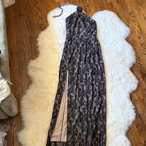 Amanda Uprichaed black and nude lace gown with rosette